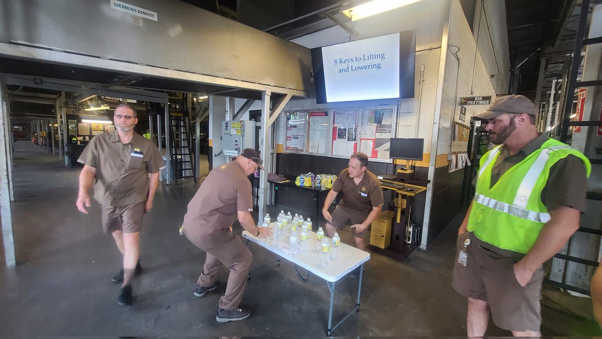 Utilizing a shorter table to create coversation we reminded drivers about bending their knees when lifting/lowering packages..