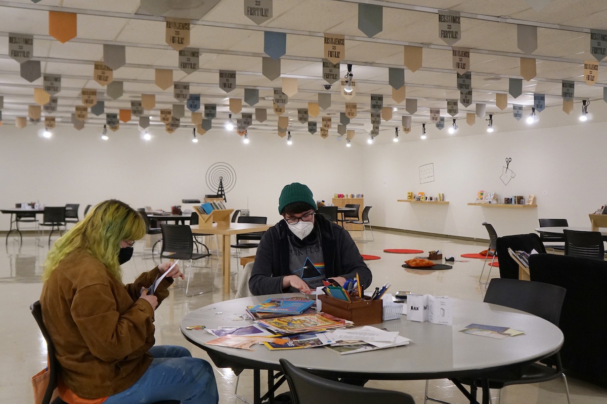 OwensArtGallery's tweet photo. The Owens Free Space is open for just a few more days. Add your voice to this space up until Sunday!
Explore nearly 450 zines, then make your own. Experiment with adhesive vinyl and add to the mural. Play a record or just hang out, this space can be what ever you need it to be. https://t.co/oBKFj7z5dR