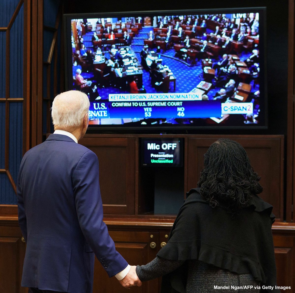 President Biden and Ketanji Brown Jackson watch together as she is confirmed to the Supreme Court.