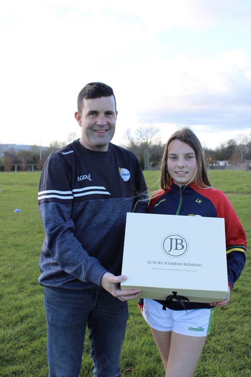 CarlowLGFA's tweet photo. Carlow Chairman Colin Doyle presenting Lillie Mae Hosey with a hamper to the value of €400 from @Jo_Browne. Lillie Mae was one of the prize winners in our Mother’s Day Development Draw and Carlow LGFA are delighted to have such a successful Carlow business woman supporting us 🙌🏼 https://t.co/bY72i9Jbdt