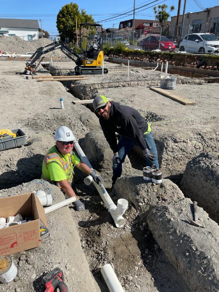 MAPLEService's tweet photo. On the job at the new Food for People. Our Barney Huddelson and Cedar Dillon.  Installing the underground plumbing for our client, Pacific Builders. https://t.co/gtN5w7tqOI