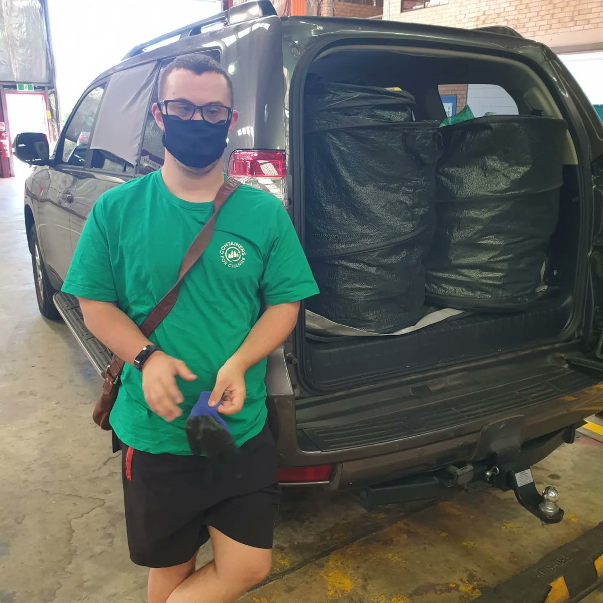RecycleManPerth's tweet photo. Viko unloading the trusty Prado at #returnit #recycling #containers4change #4changewa #downsyndromeawareness #DownSyndrome https://t.co/RltiLkoED2