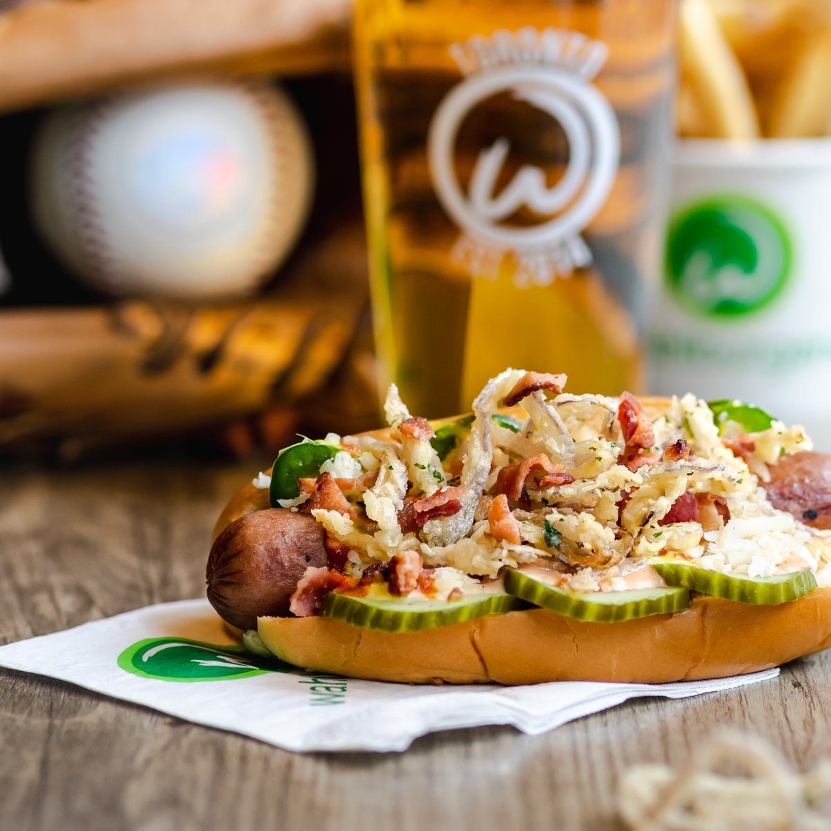 ⚾ Baseball is back &amp; Wahlburgers’ new feature The Slugger will be hitting dingers this season!

A street-style hot dog 🌭 that hits hard with an abundance of flavours &amp; textures, comprised of beef frank, crispy onion rings, pickles, wahl sauce &amp; more. Limited time feature.