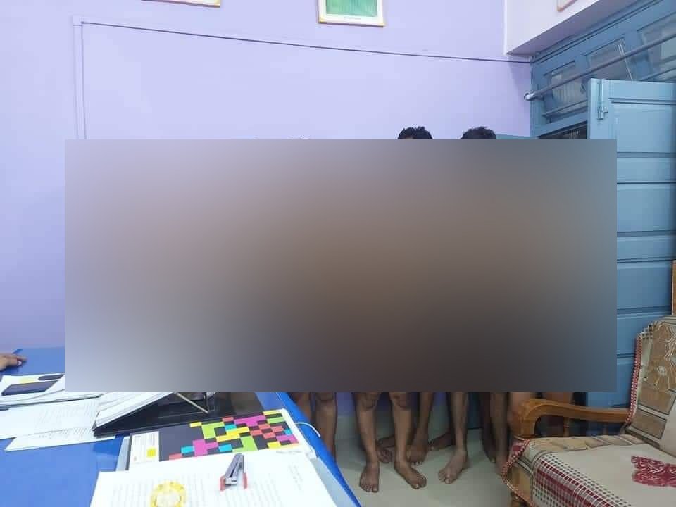 ANI's tweet photo. MP | Police station in-charge Kotwali Sidhi and a sub-inspector suspended and attached to the Police Lines in connection with the matter where a group of men, including a journalist &amp; YouTuber, was seen only in their underwear inside a police station in a viral photo (in pic). https://t.co/qgapFfo3HP