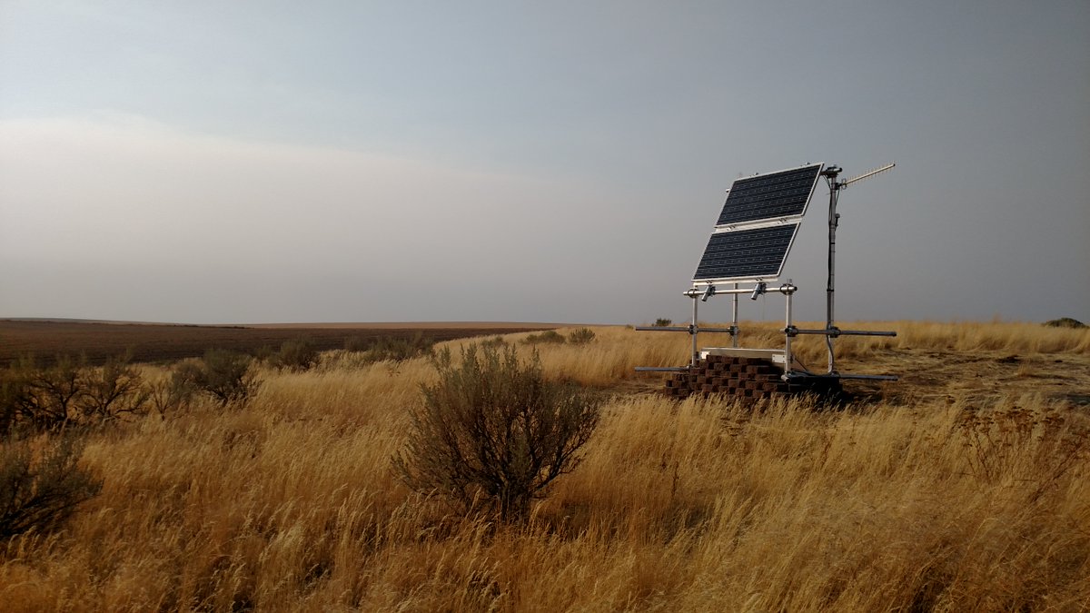 Station EPH2 sits in a grassy open field. The sky is grey.