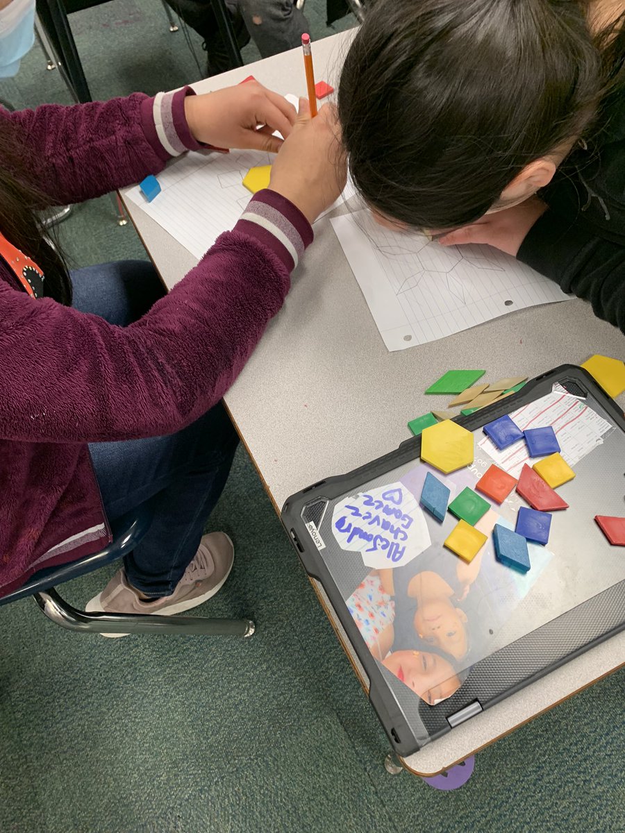 johnsonamiss's tweet photo. Happy 🌍 day! We made flowers out of tangrams, graphed what shapes were used—then calculated the price of one flower, a half-dozen and a dozen. https://t.co/RoK2fa7q6N