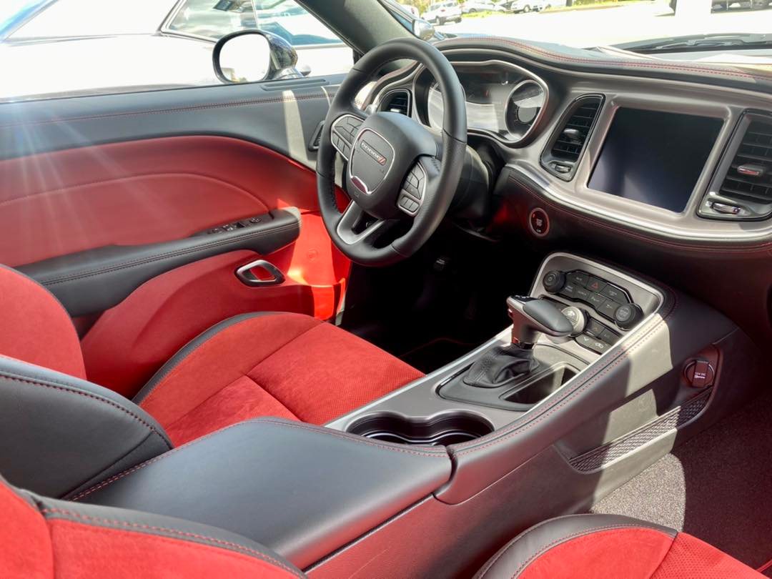 JonesDodgeMD's tweet photo. Check out our Sales Professional, Ian, showing off this NEW 2022 Dodge Challenger R/T SCAT PACK!
That Ruby Red interior speaks for itself, but it also has features like Apple 🍎CarPlay, an Exterior Parking Camera📸, Heated Seats &amp; Steering Wheel 🔥, and more! https://t.co/KIgXWeQ9bS