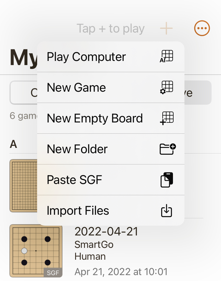 Popup-menu in SmartGo One showing Play Computer and New Game, as well as a hint 'Tap + to play'.