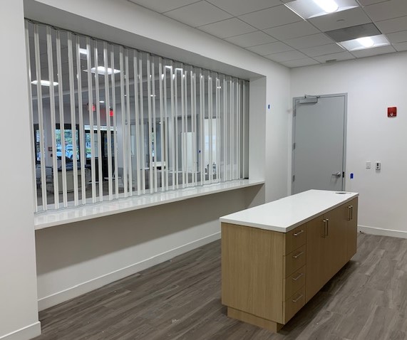 Yet another great installation from our partner Folding Walls of Miami. 
A healthcare facility needed to separate a space, yet also have visibility, &amp; security for its counter area, the Woodfold 440model filled the need successfully.
