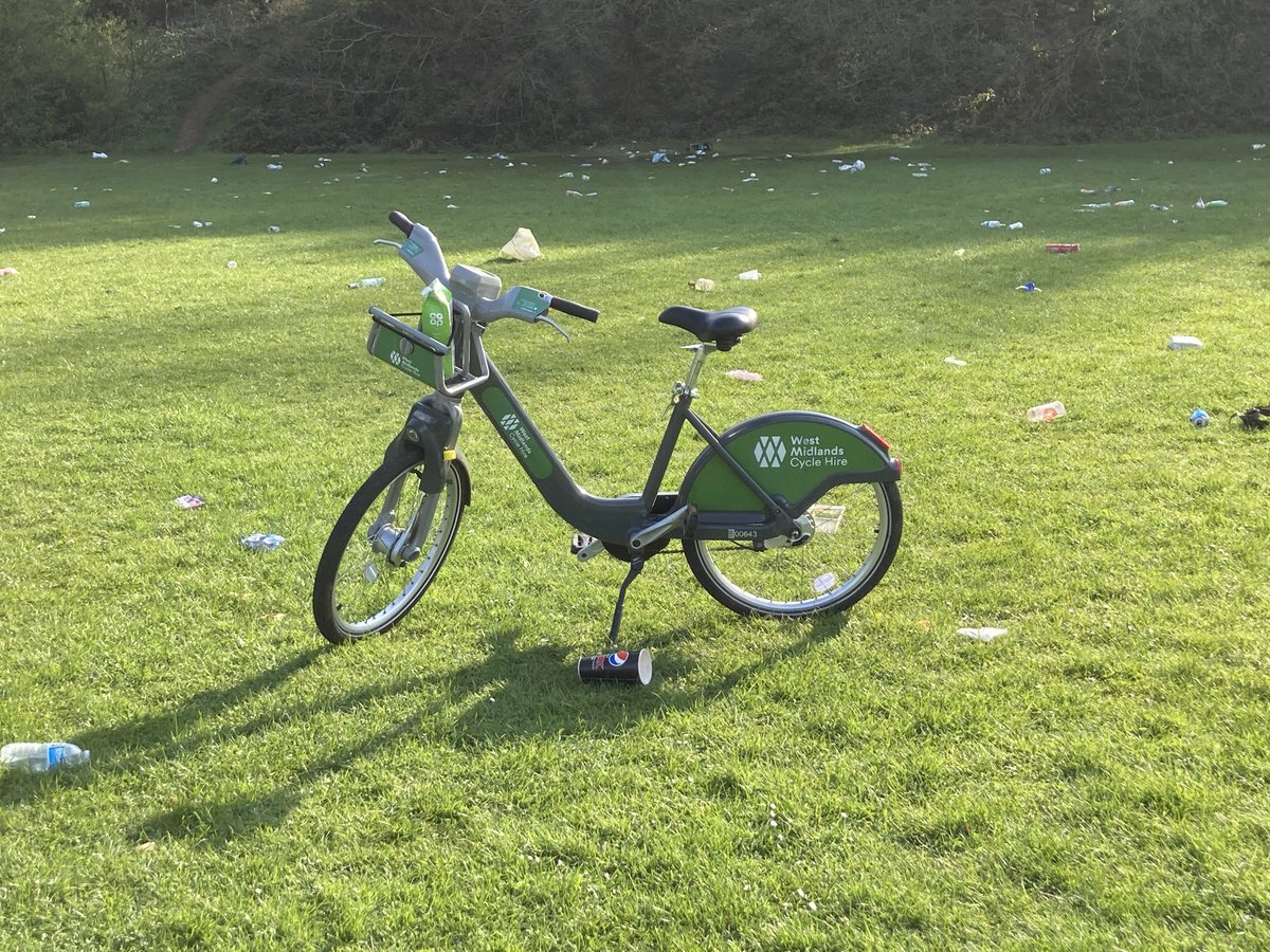 fieldfriends's tweet photo. ⁦@WMCycleHire⁩ here’s the pic of the bike, with number &amp; some litter in the background (was plenty more).  BTW Birmingham Parks Byelaws prohibit riding any bike in parks except on designated cycle paths, and the field certainly is not that.  What penalty can be issued? https://t.co/Ydk5pKfqCh