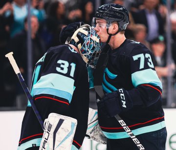 Kole Lind smooches Philipp Grubauer’s helmet following the team’s 3-2 win over Colorado