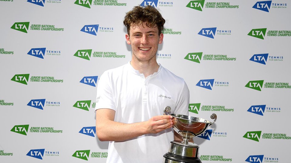 Luca Pow holding a trophy.
