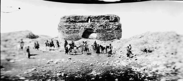 Kurdish men in front of the ruin of a ancient palace, Qasr-e Shirin 1911.