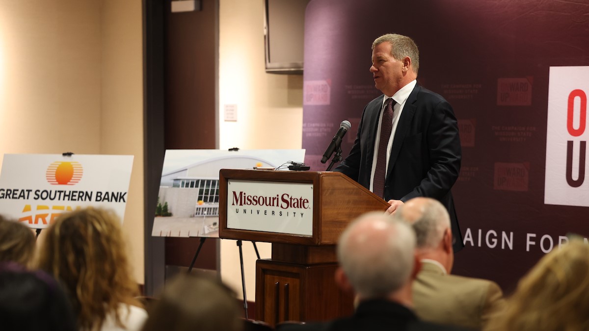Joe Turner of Great Southern Bank speaks to a crowd while announcing the name of the Great Southern Bank Arena.
