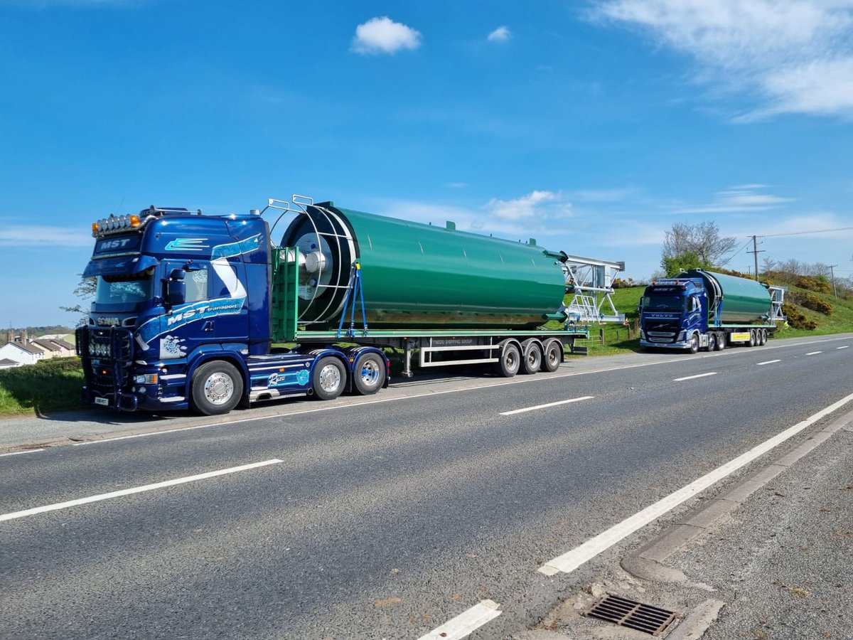 A beautiful day in #northernireland - our local partners taking care of business with some wide & long silos for export to GB. #hgv #flatbed #scaniatrucks #volvotrucks