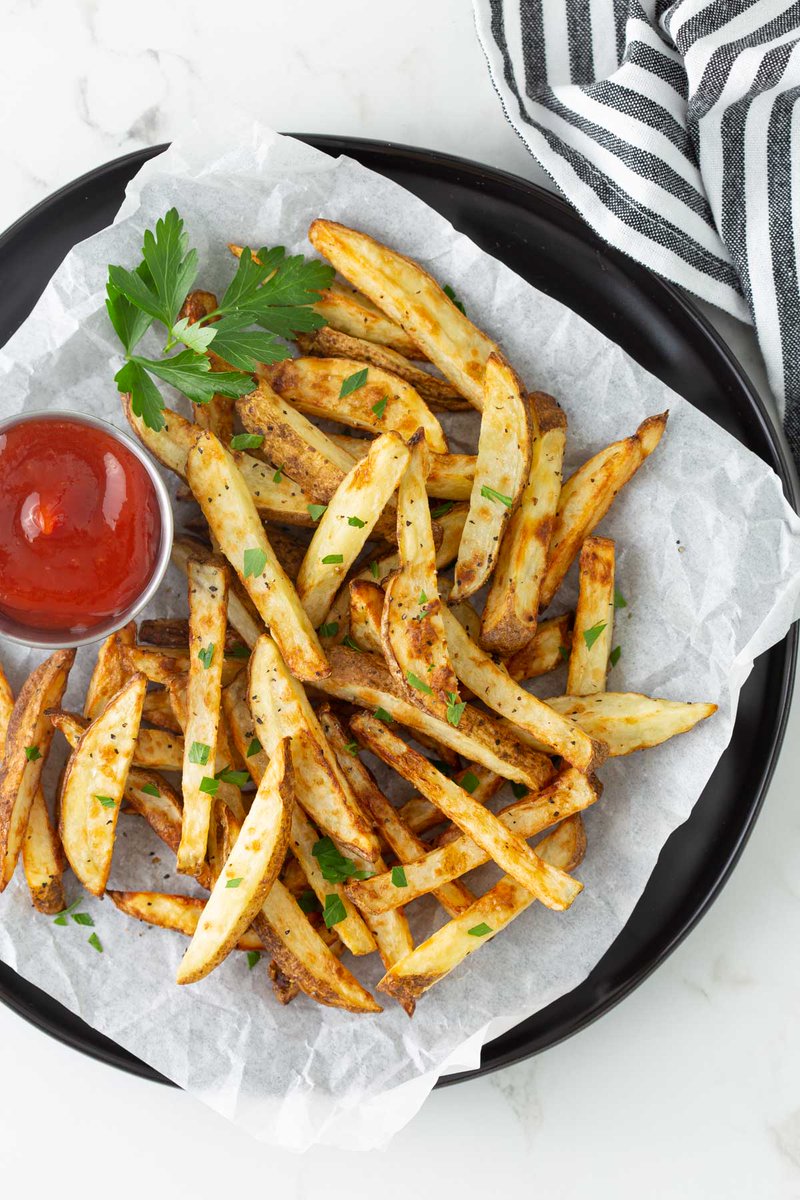 Delicious Air Fryer French Fries are so easy to prepare using a fraction of the oil. A healthier alternative to traditional deep frying!  bit.ly/3rJif0e #airfryer