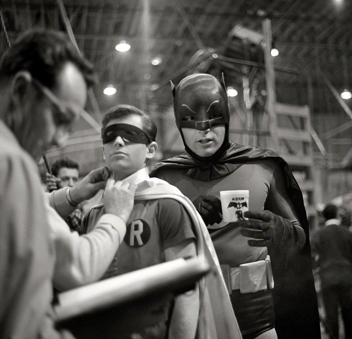 Burt Ward and Adam West during a break from filming on the set of Batman: The Movie (1966)