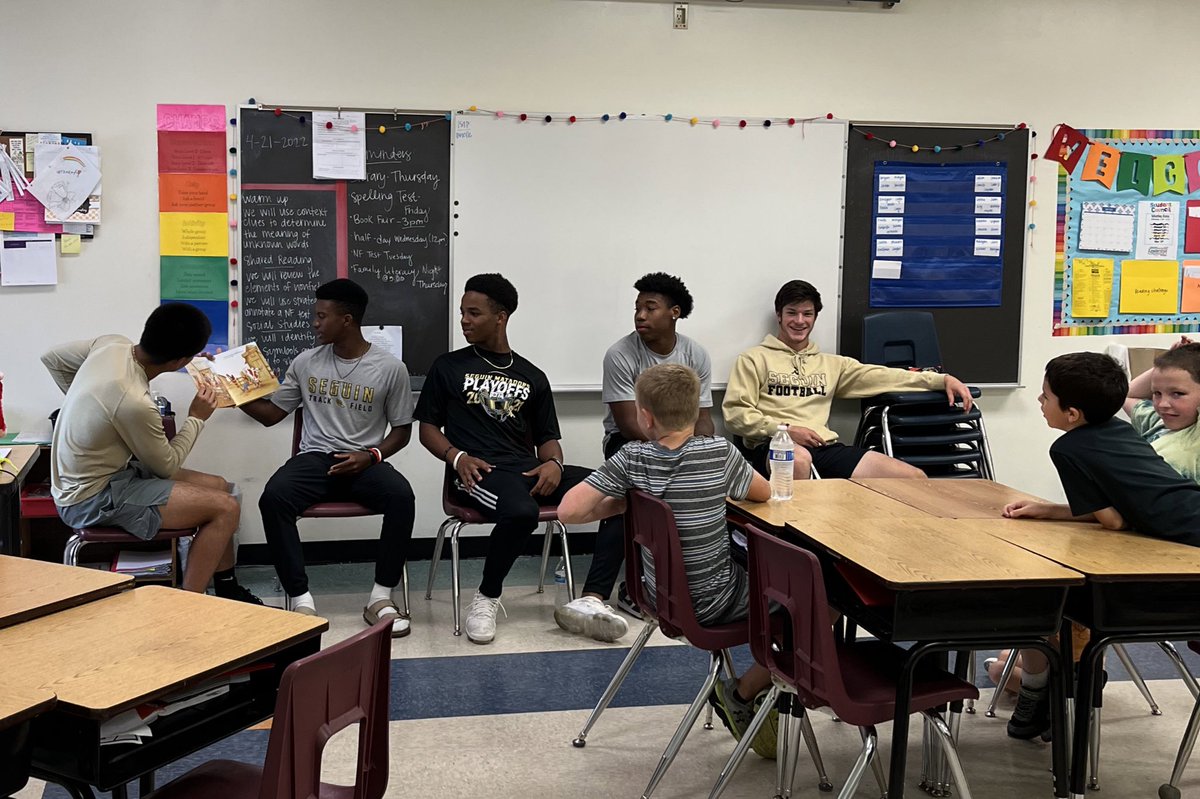 Members of the Seguin Matador men's track team reading to elementary students at Vogel's literacy night. #familyofchampions #communityservice #StudentAthletes @daveion_lockett @DevooTAKEflight @Donovan2Cray @JakobMcleod35 and Isaac Garcia @TrackSeguin @Seguin_Football @SeguinHSTx