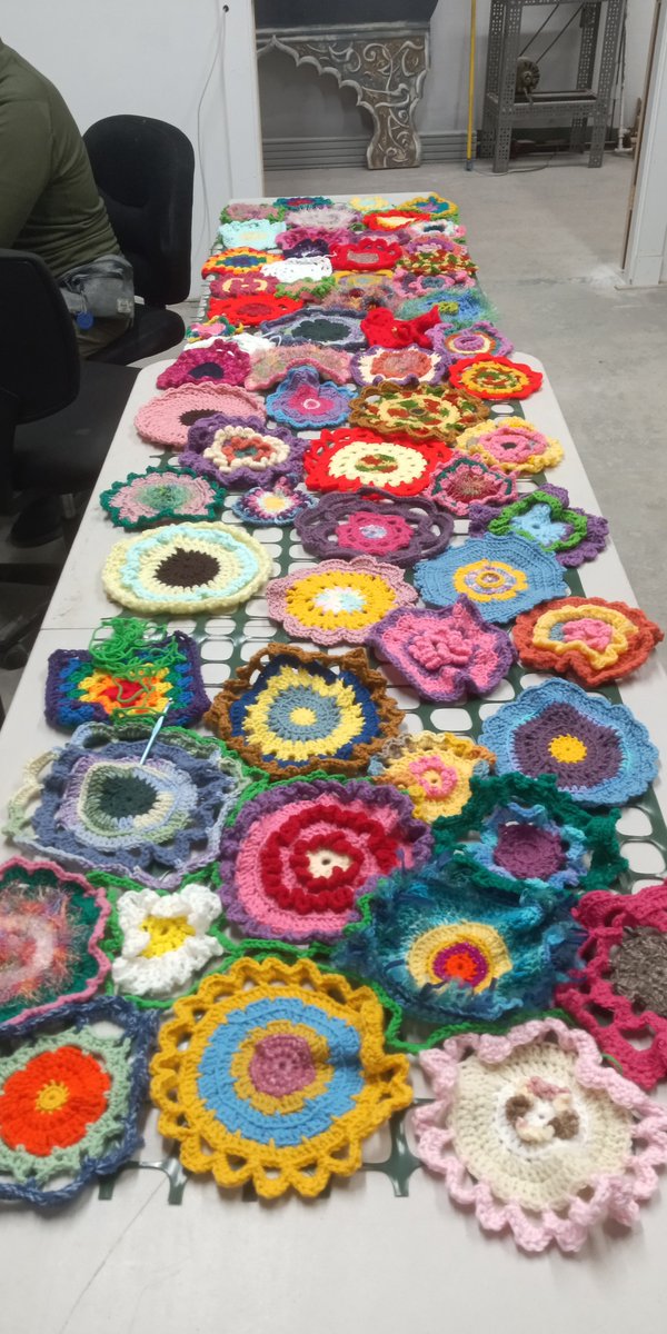 FraminghamMaker's tweet photo. Framingham Makerspace has made and collected from crocheters across the city hundreds of crocheted flowers for the installation in the Arlington Street park. We will mount them on the chain link fencing that separates the basketball court from the playground. https://t.co/lOjxELEGin