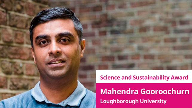 Portrait photograph of Mahendra in front of a brick wall.