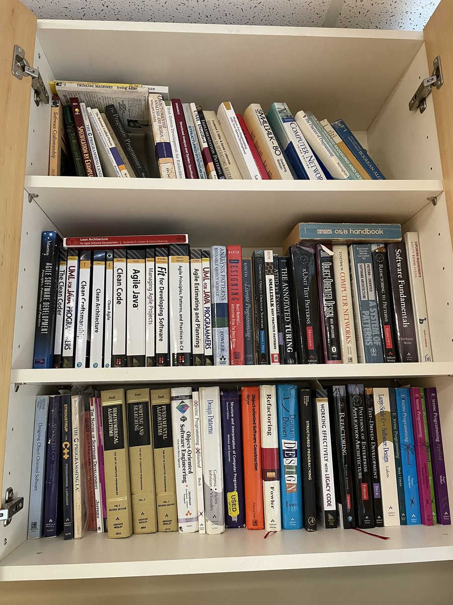 My bookshelf of honor just above my desk. These are the books I keep at the ready. Most referenced at the bottom. Most cherished at the top. 

My other six book cabinets are not shown. <grin>.