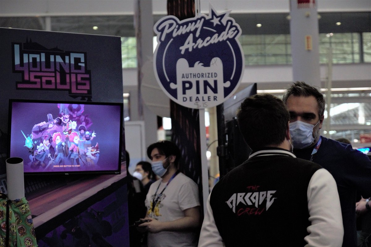 You can see on this picture two Dotemu employees in front of the game Young Souls, playable at our booth. 