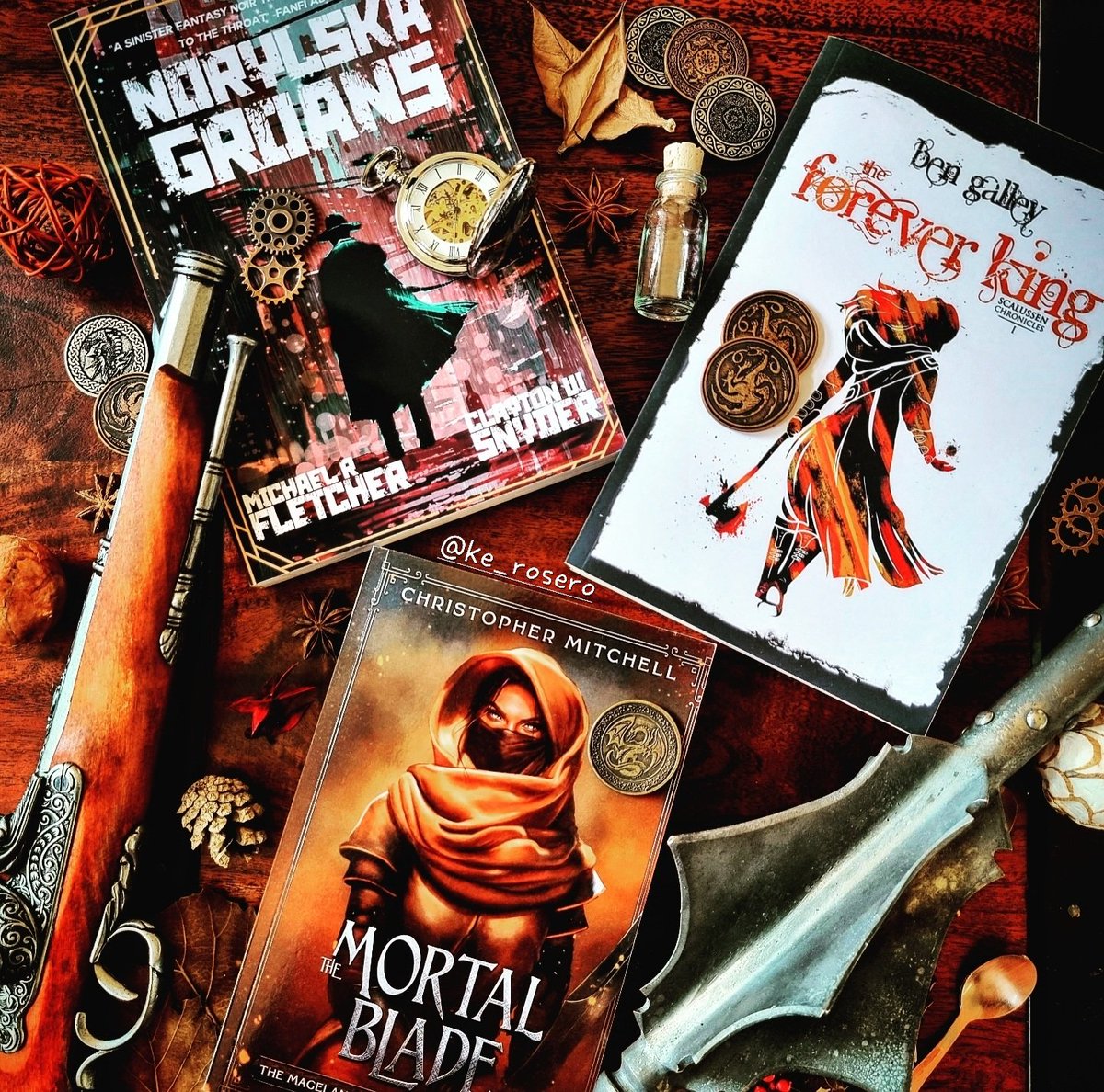 ke_rosero's tweet photo. I'm so excited about these. I've already DEVOURED half of one and can't wait to dig into the others ⚔️📚⚔️

Norylska Groans (@ClaytonSnyder2 + @FletcherMR) 🖤 Cover: Clayton! 

Forever King (@BenGalley) 💚 Cover: Pen Astridge 

Mortal Blade (@CMitchellAuthor) 🧡 Cover: @miblart https://t.co/JrSdADr81W