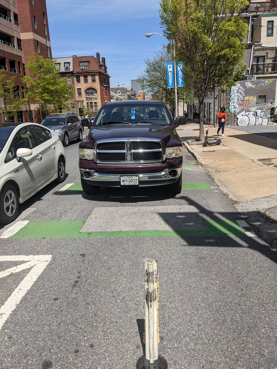 Happy earth day to this person parked in one of Baltimore's few "protected" bike lanes right next to an open parking spot 🌍💚 <a href="/NotASpotBmore/">NotASpotBmore</a>
