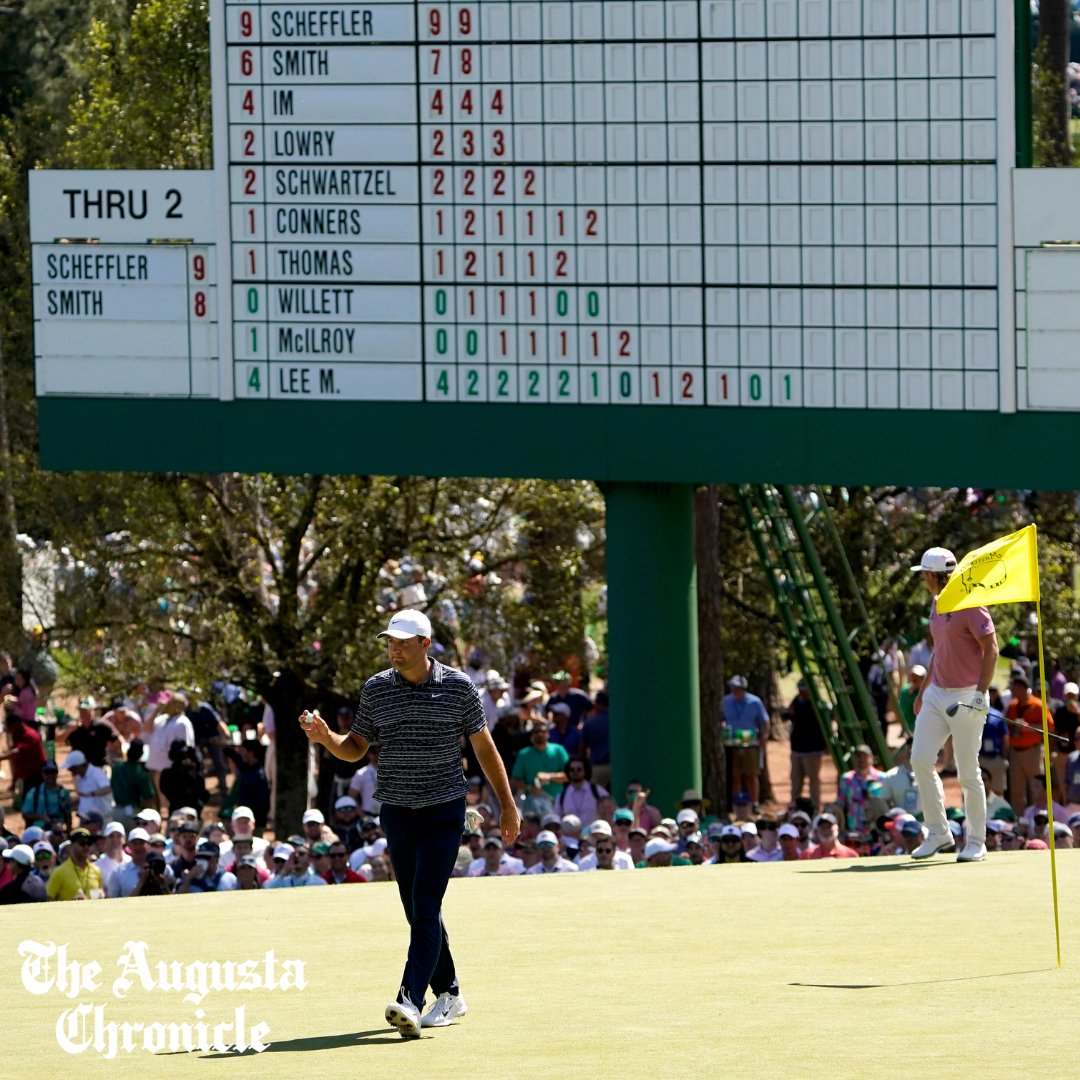 Scottie Scheffler celebrates after chipping in for birdie at No. 3 during the final round of the 2022 Masters.
