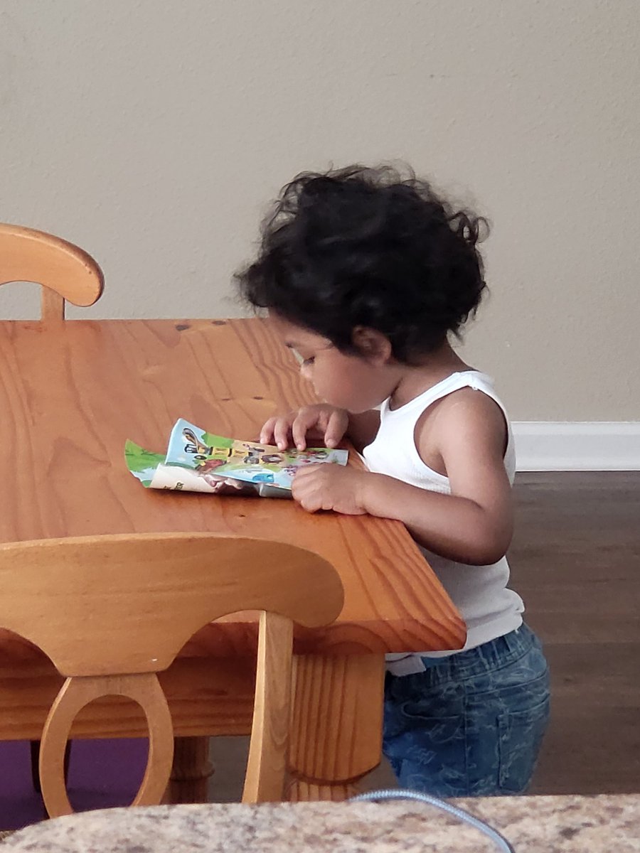 earlyassets's tweet image. In a quiet moment, all to himself, a toddler chooses to explore a book. As an ECE it is important for us to set the stage and provide the opportunity for engagement.