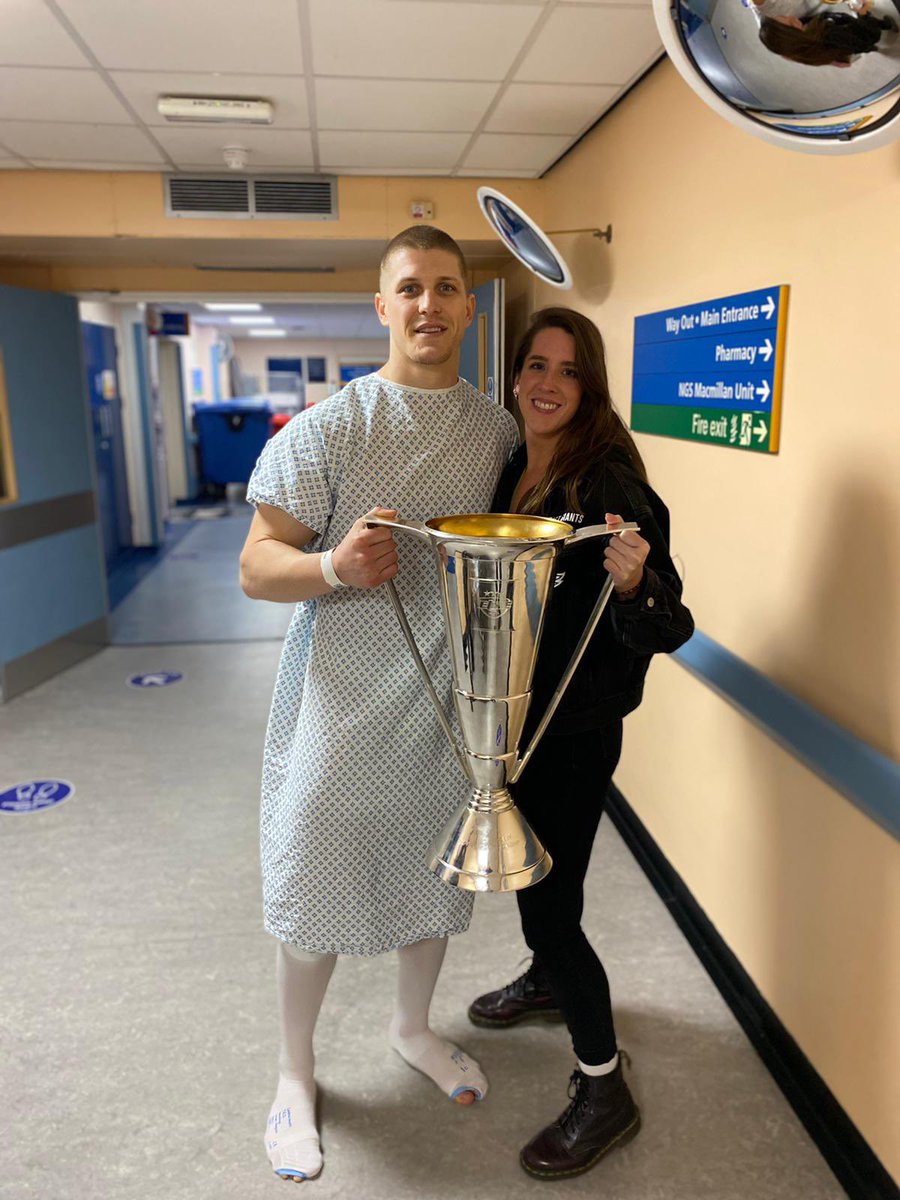 BelfastGiants's tweet photo. Celebrations couldn’t start without taking the trophy to see @makeitraine11, who woke from surgery to hear he’s a champion AGAIN. https://t.co/amhdmNbLR6