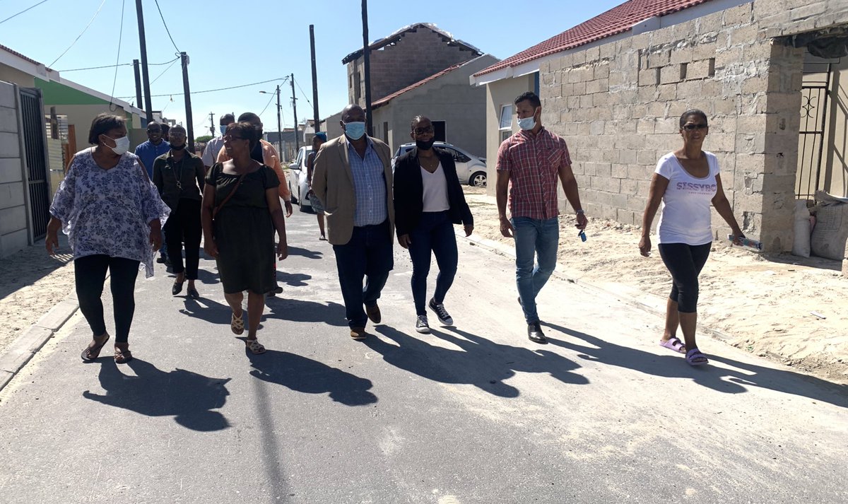 ewnreporter's tweet photo. #DelftElectricity Eskom officials and residents walk through the area of Eindhoven where Eskom connected 133 of the 181 homes in the area https://t.co/JbBYI5miPQ