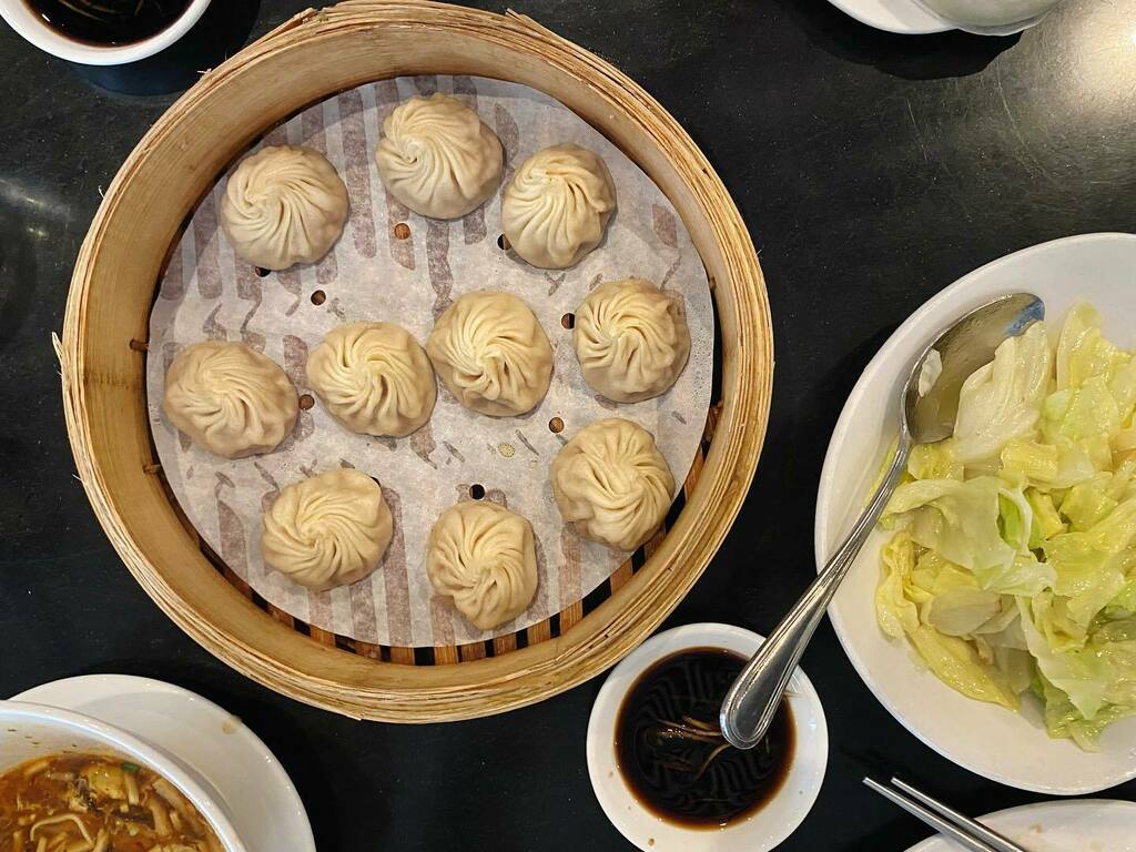 Happy happy place // Kurobuta pork xiao long bao, Taiwanese cabbage with garlic, noodles with spicy sauce, vegetable and Kurobuta pork spicy wontons, Kurobuta steamed pork buns, hot and sour soup, and cucumber salad from Din Tai Fung Pacific Place in Seattle (Pacific Place),…