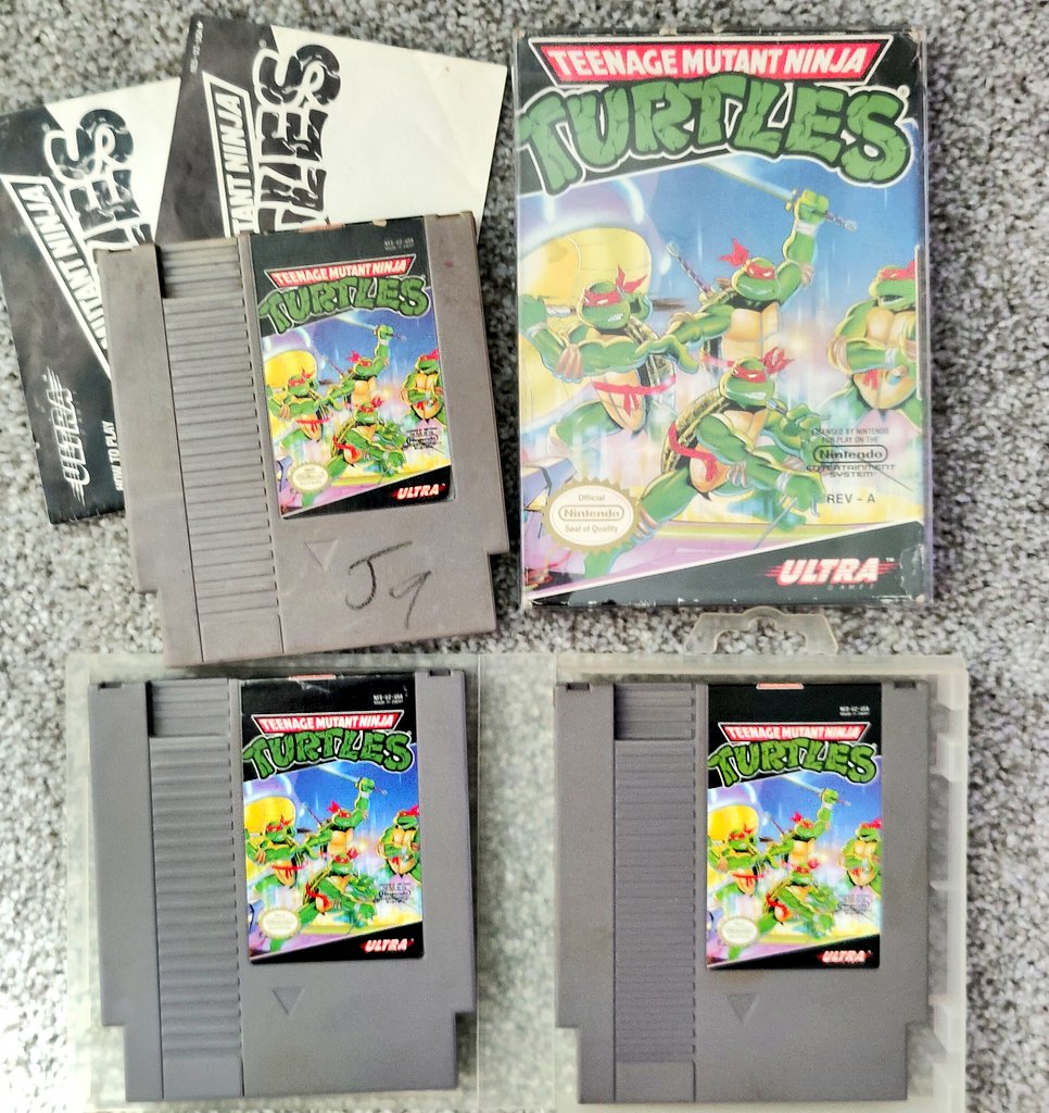 longie_long's tweet photo. I've got 4 copies of TMNT for the #NES. Why? I don't know and neither does my doggy.
#TMNTWeek https://t.co/MAzCZ9NneG