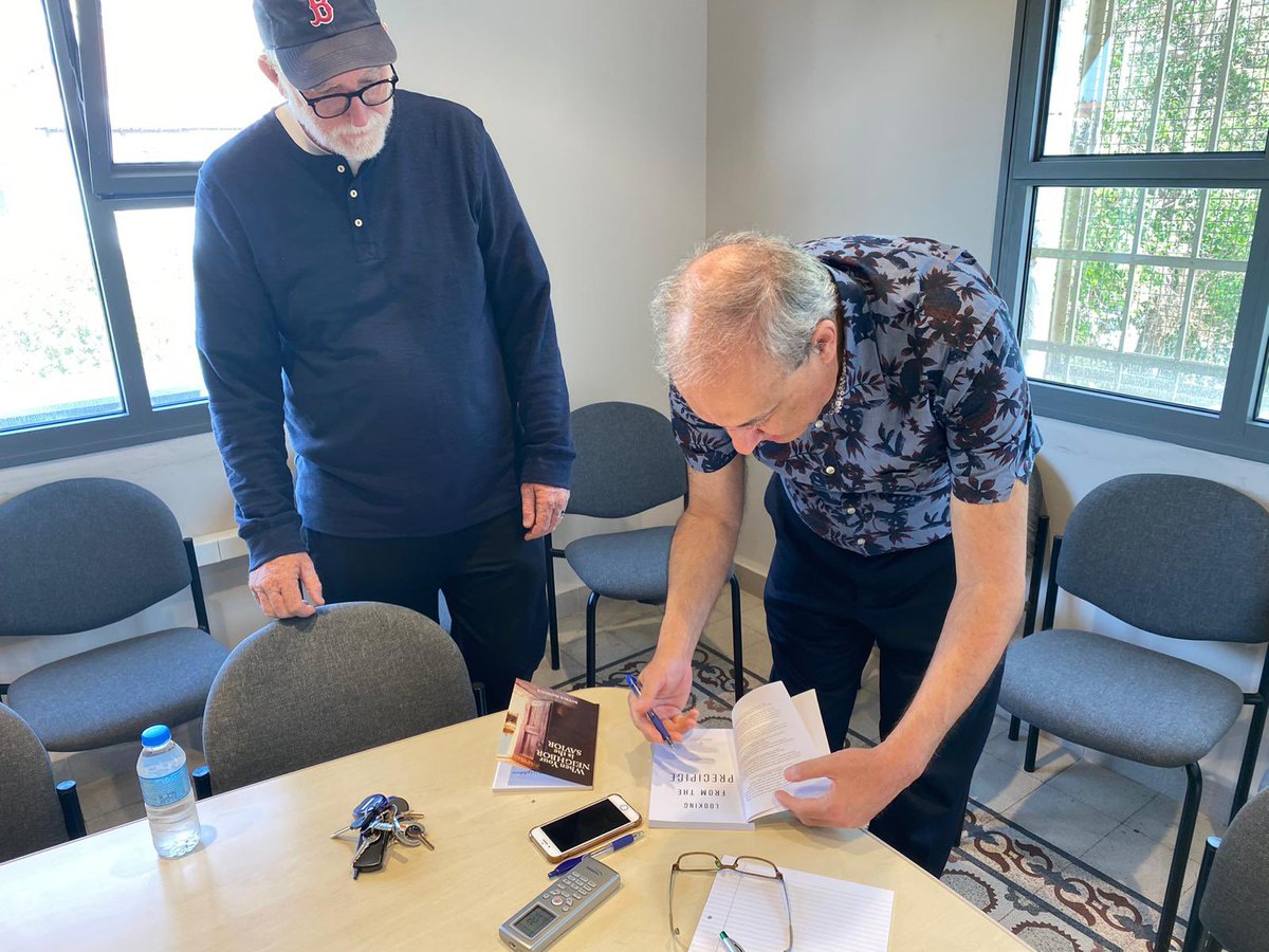 Had a chance to talk today to a delightful American group led by “Love does ” author Bob Goff. I presented Bob my 2 books in English. In the picture- While signing it to him.