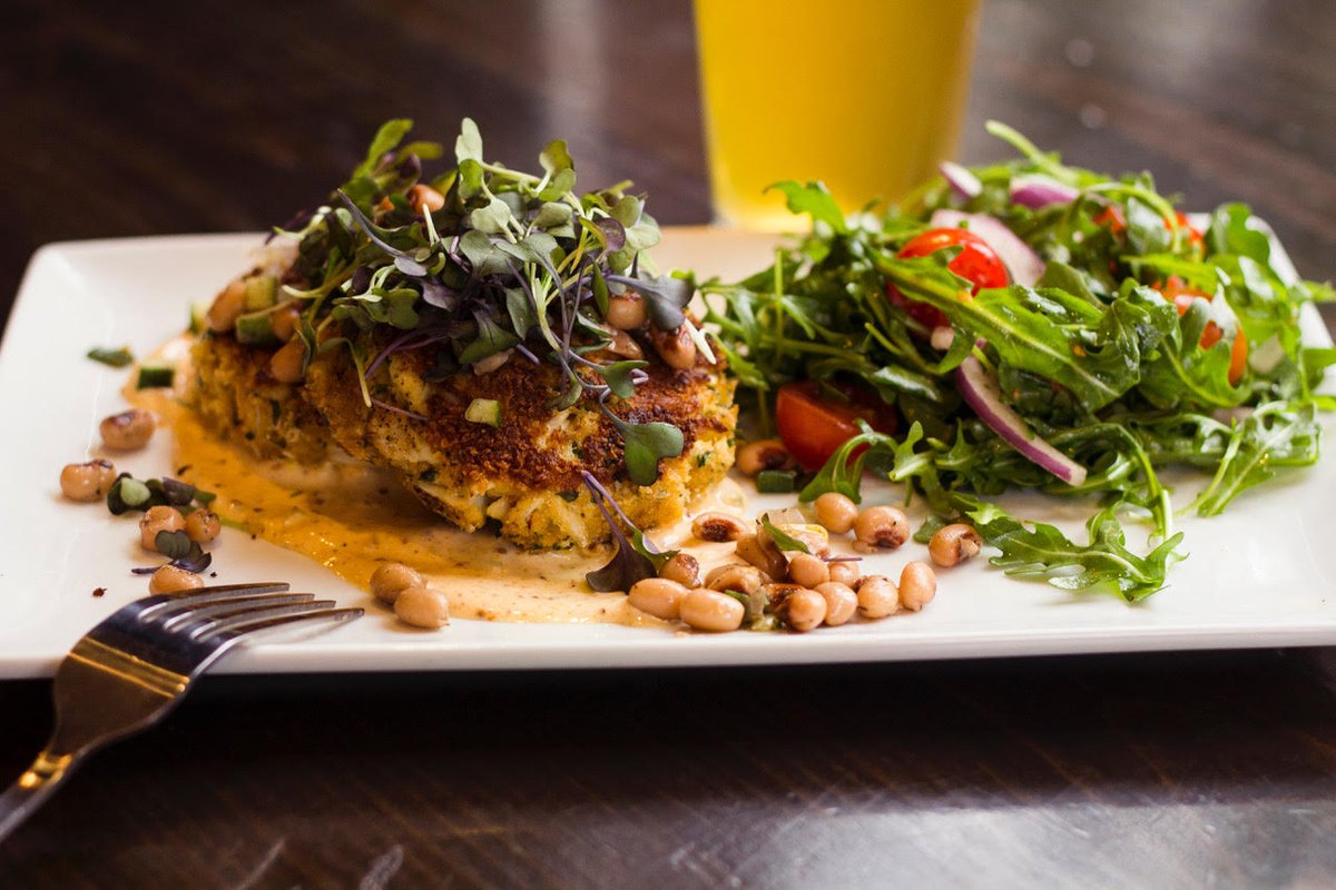 StockyardBurger's tweet photo. Feelin' Crabby? 
Indulge in our made-in-house Seared Lump Crab Cakes, with Black-Eyed Pea Medley, Cajun Tartar, topped with Micro Greens and served with an Arugula Salad, Cherry Tomatoes, Onions, Truffle Oil #crabcakes #indulge https://t.co/aKr3zUfclC
