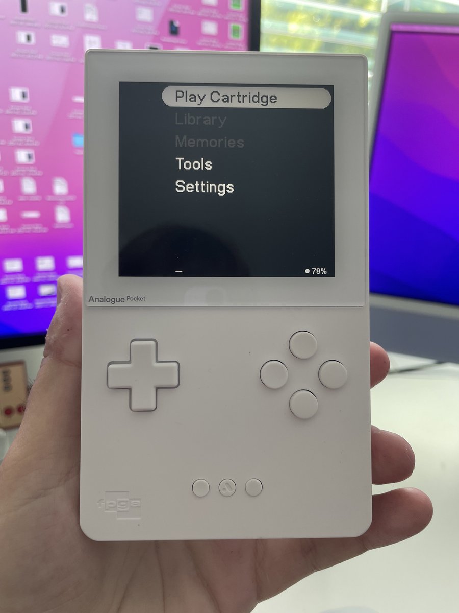 White Analogue Pocket with screen turned on, showing main menu.