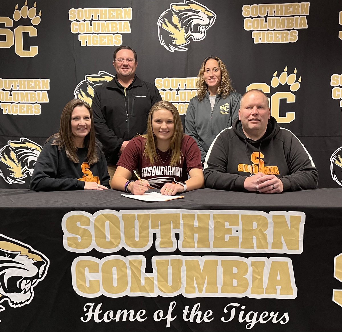 Summer Tillett recently committed to continue her Academic &amp; Athletic career at Susquehanna University. Summer will play Basketball for the River Hawks. Seated w/ Summer are her parents Lisa &amp; Wes Tillett along w/ AD Kent Lane and Head Coach Kam Traugh.