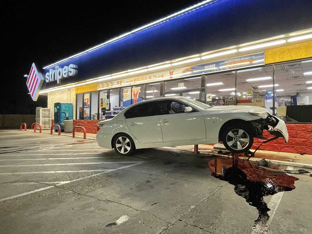 DMontezNews's tweet photo. PHARR- A woman driving a BMW ended up on top of a parking lot barrier at a Pharr stripes store. 

Police are now searching for the woman responsible for this wreck as she fled the scene. https://t.co/hy0vV1BuDR