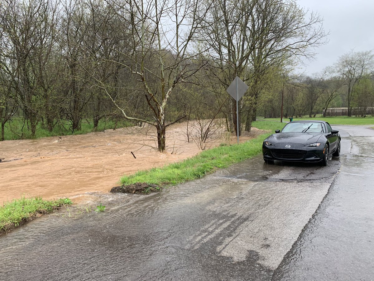 thejenomatic's tweet photo. @NashSevereWx Creek in Cheatham Co, normally low and clear. Currently 6-8’ higher than normal, just receded from over the road. Cars will disappear in this! Drive safe! #tspotter https://t.co/36fd3Qv4CA