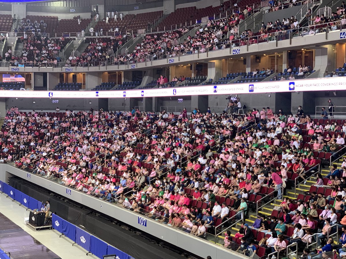 newswatchplusph's tweet photo. LOOK: It’s a sea of pink inside the Mall of Asia Arena as fans from rival schools Ateneo and La Salle join forces to show support for presidential candidate VP Leni Robredo | @PaulineVerzosa https://t.co/jl59OX2ZII