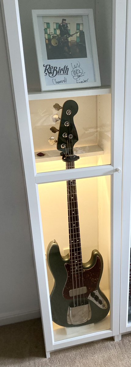 feederanorak's tweet photo. Taka’s bass guitar, now proudly displayed in my office ❤️🎸 picture is a still from the ‘Paperweight’ video in which he used it 🤘 I may tweak the display a little in future but need a different frame first 🙂 @FeederHQ https://t.co/lCayMdYFIU