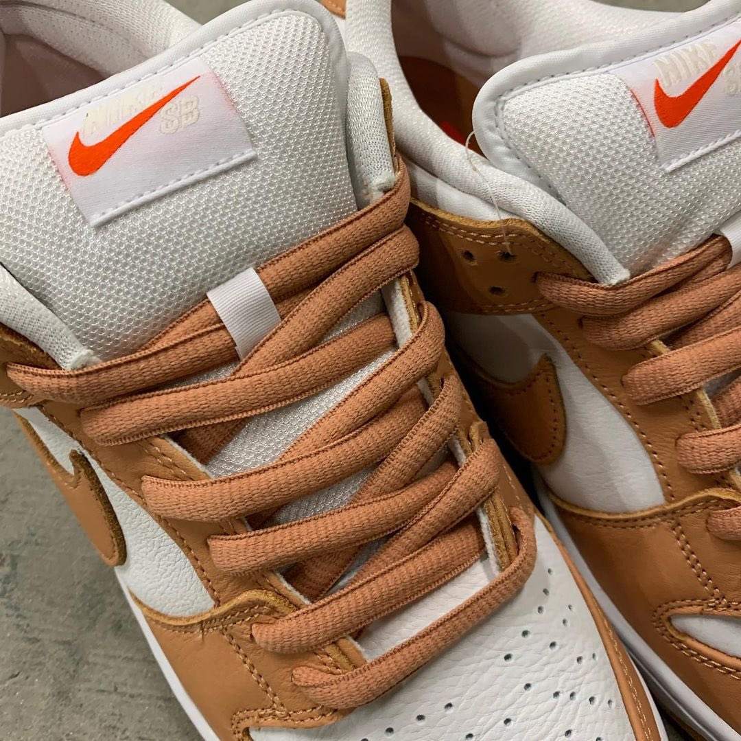 light cognac dunks on feet