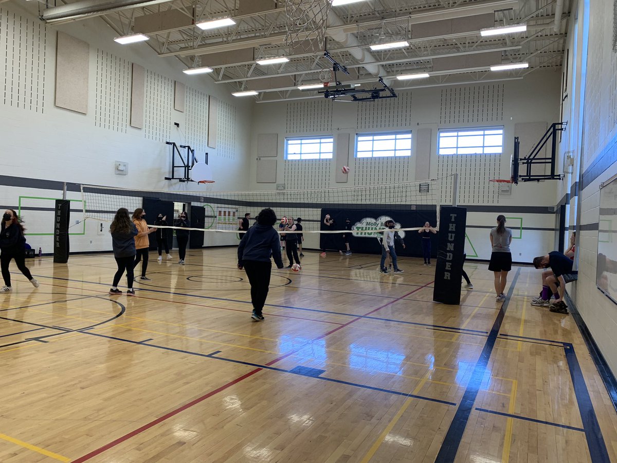 Staff appear to be a little outnumbered in the warmup for the staff v students volleyball game. I hope the kids go easy on them. What a fun way to commemorate great teams.