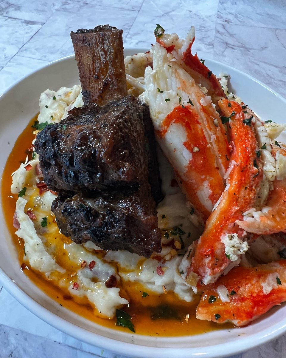 Surf & Turf Mash. Red Wine Braised Short Rib. Red King Crab. Creamy Asiago Red Potatoes. Compound Butter. Red Wine Au Jus.