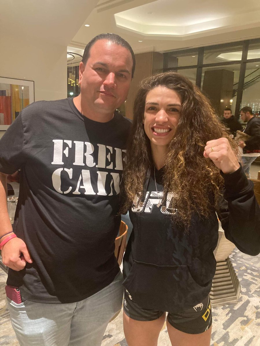 Extremegonzo's tweet photo. Shout out to @MMAUNCENSORED1 for the awesome shirt that I wore to #UFC273 this past weekend. Had the pleasure to pose with the victorious #MackenzieDern while wearing it. #FreeCain https://t.co/oB7QXLIswH