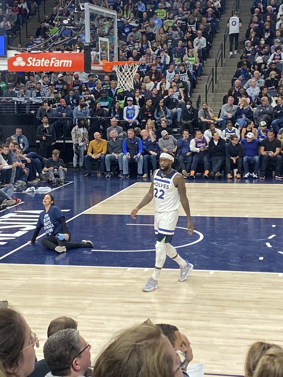 MoonyAlam's tweet photo. When taking a pic of Pat Bev and you randomly also catch a protester glueing her wrist to the court.. huh?! 

#Timberwolves @Timberwolves https://t.co/ryefP3jKo3