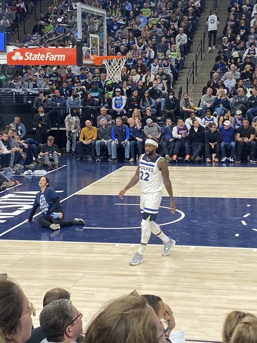 DxEverywhere's tweet photo. DxE investigator Alicia Santurio is the protestor who disrupted the Timberwolves game, supergluing herself to the court after today’s investigation exposed team owner Glen Taylor’s factory farm brutally killing 5 million birds via “ventilation shutdown” https://t.co/4XQWB195mK https://t.co/aR27AS7NJe
