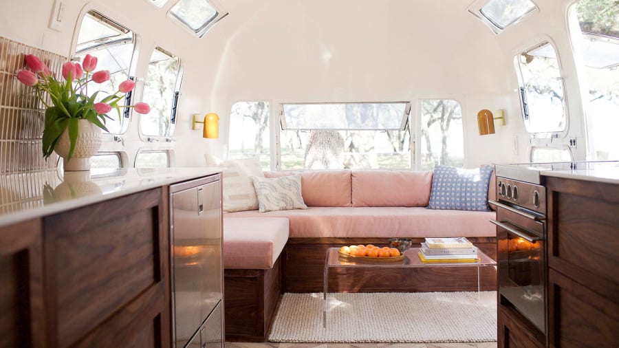 CNN's tweet image. Kate Oliver and her wife, Ellen Prasse, not only succeeded in making van life a reality -- but also turning it into a business that took them all over America as they repaired old Airstream camper vans. cnn.it/3Eblraf