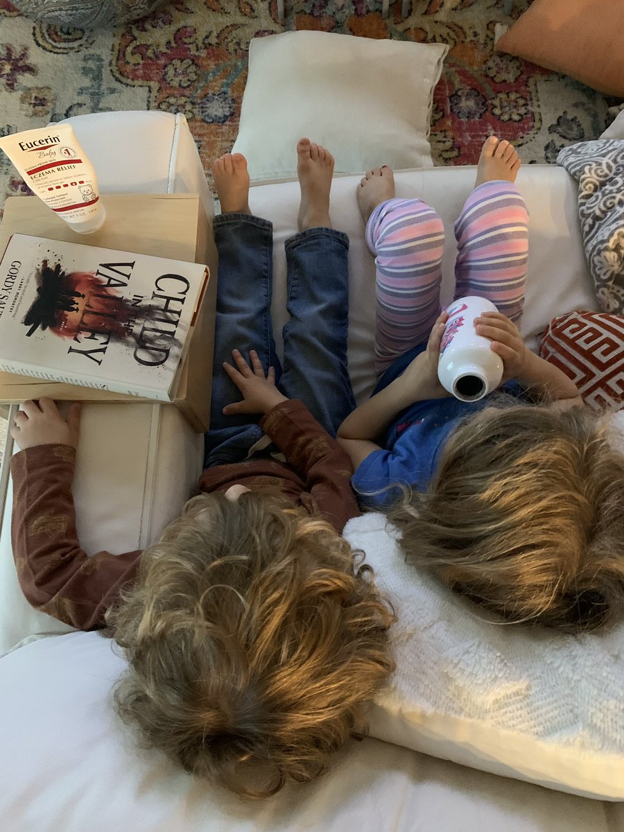 My niece and nephew with my book. Will be a while before they can actually read it. But still… heartstrings.